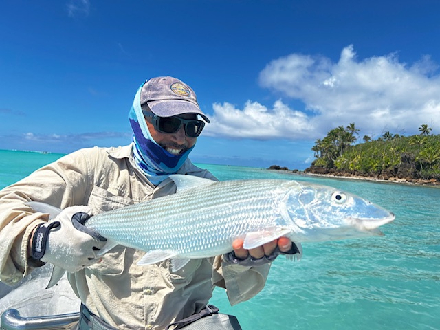 Guest Roman holding a bonefish caught on Aitutaki Lagoon, Cook Islands